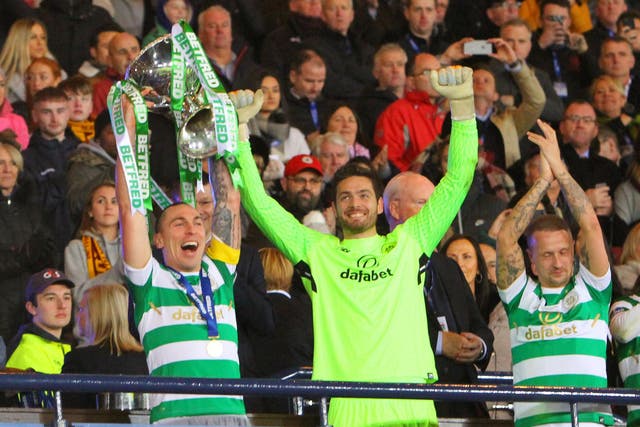 Celtic’s captain Scott Brown raises the trophy
