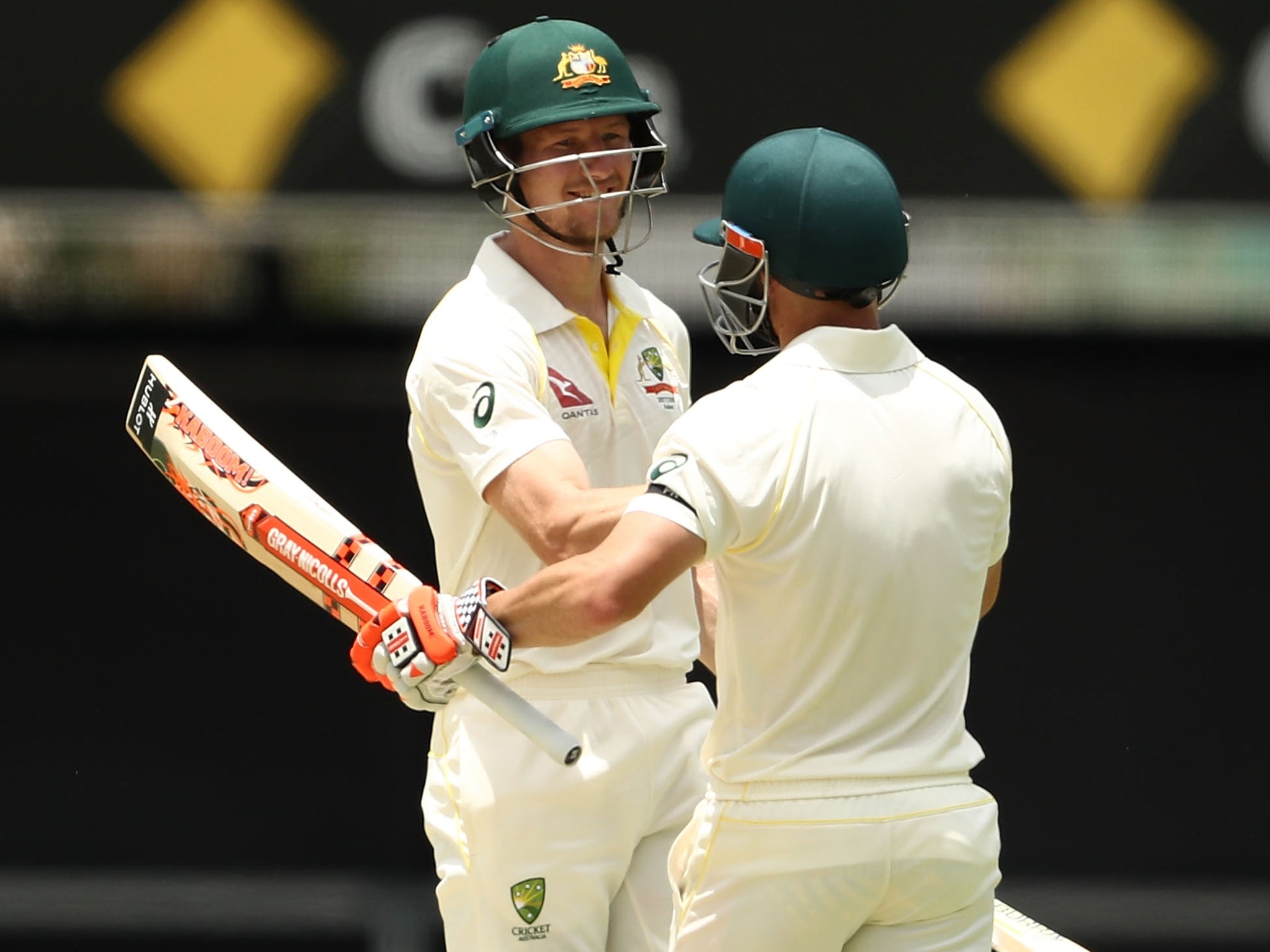 Cameron Bancroft and David Warner celebrate hitting Australia to victory