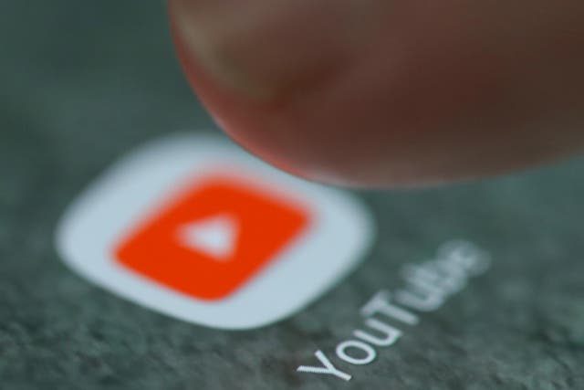 The YouTube app logo is seen on a smartphone in this picture illustration taken September 15, 2017