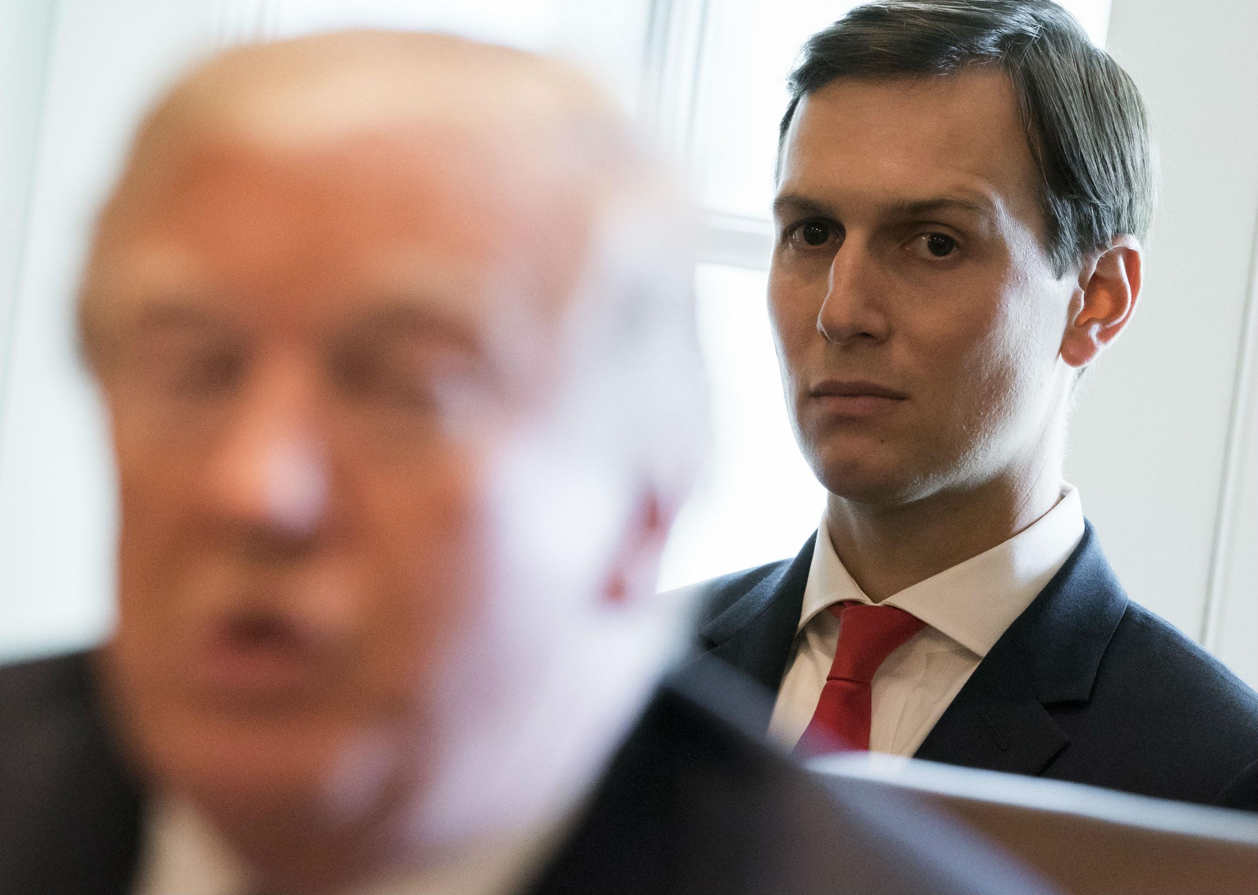Jared Kushner looks on as his father-in-law speaks