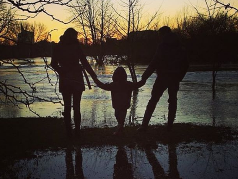 Mr Thomas posted the image on Instagram of himself, his wife Gemma and their son Ethan, 8