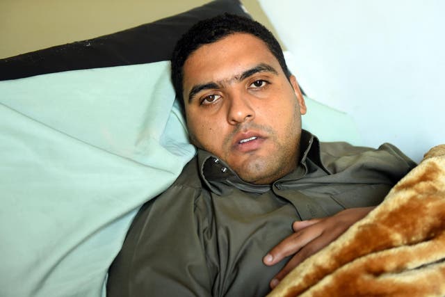 Mohammed Abdel Fattah, the imam of al-Rawda mosque, receives treatment at al-Husseiniya hospital in Egypt's northern province of al-Sharqiya on Sunday