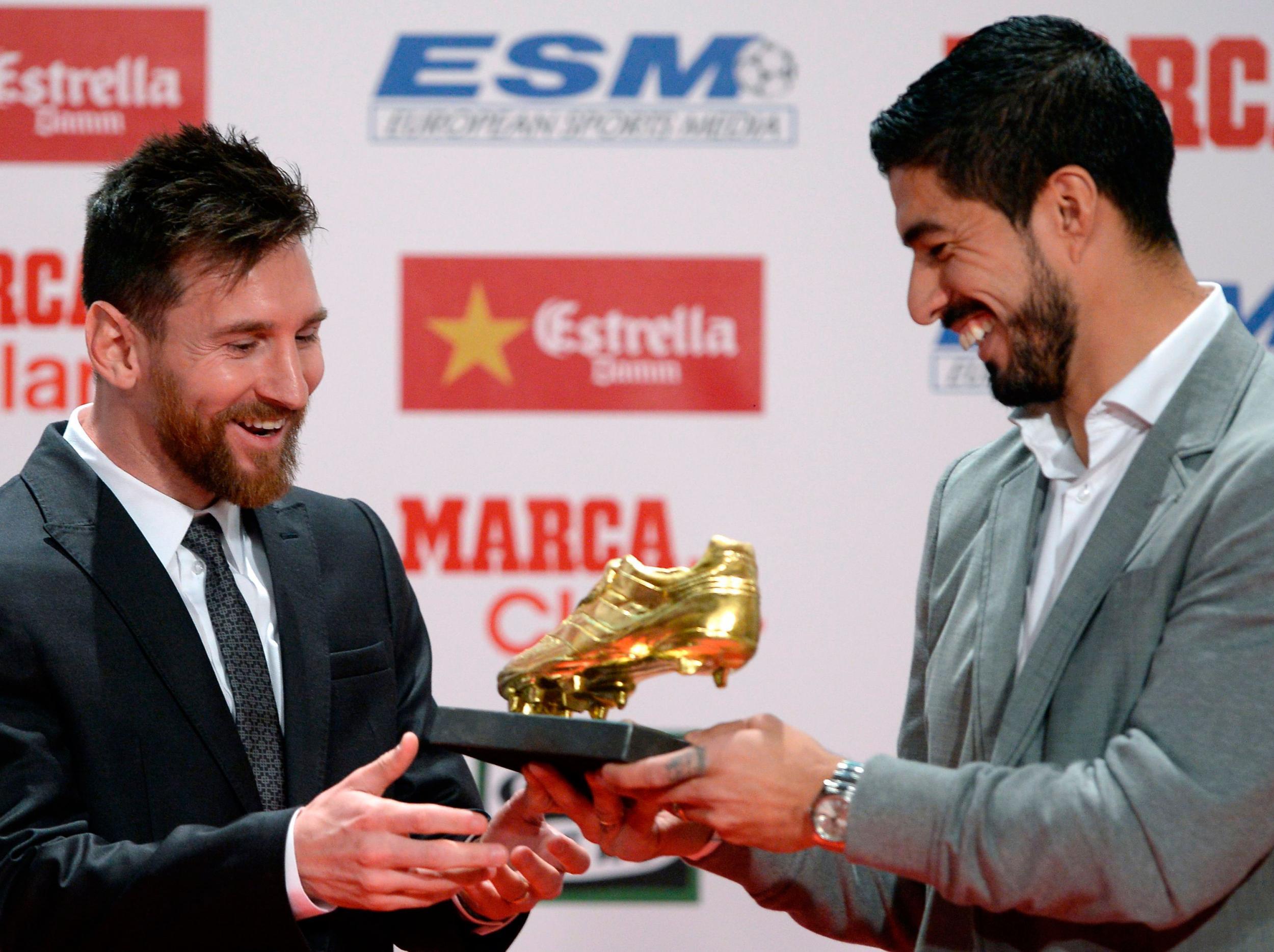 Suarez handed over the Golden Shoe to teammate Lionel Messi last week