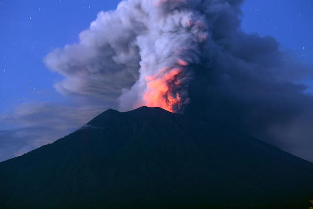 Mount Agung has stranded tens of thousands of tourists as it spits ash 4,000m (2.5 miles) into the air