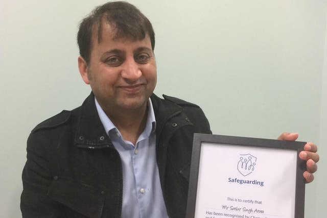Satbir Arora was presented with a certificate of outstanding achievement in safeguarding by Cherwell District Council