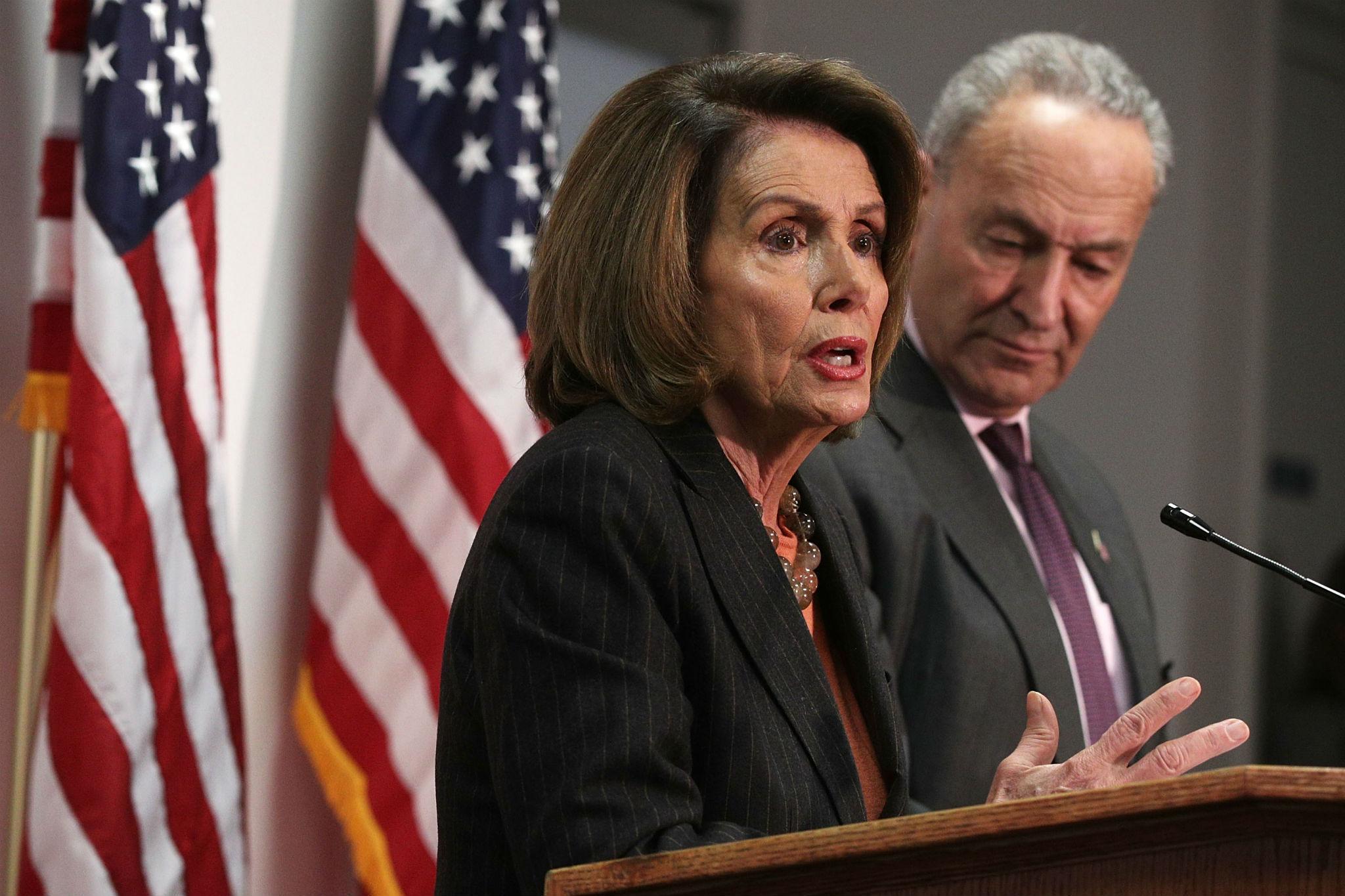 Senate Minority Leader Sen. Chuck Schumer and House Minority Leader Nancy Pelosi participate in a news conference (Photo by Alex Wong/Getty Images)