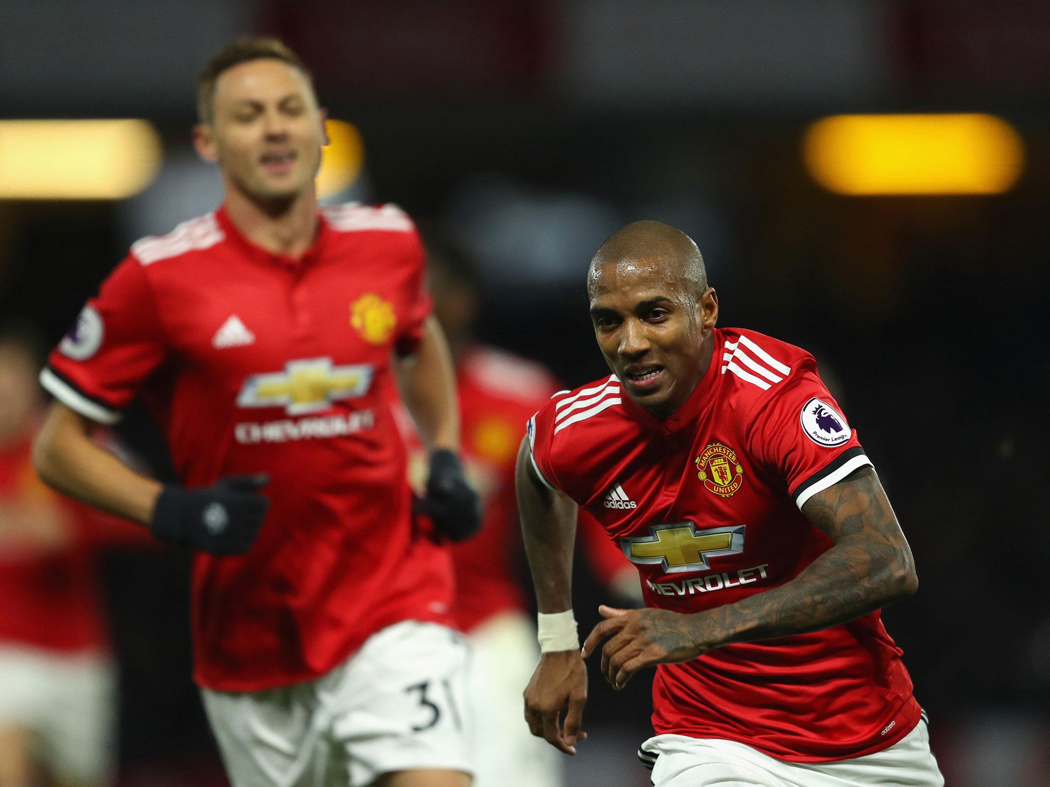 Ashley Young rushes away to celebrate his opener for Manchester United