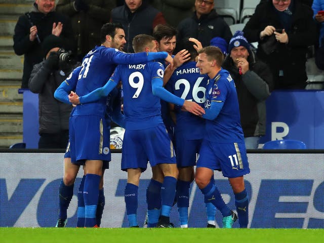 Leicester's players celebrate after doubling their lead against Spurs