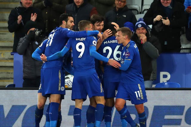 Leicester's players celebrate after doubling their lead against Spurs