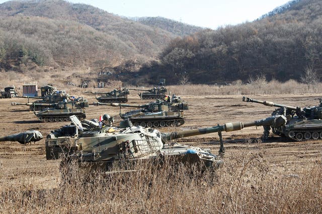 The South Korean army's K-55 self-propelled howitzers take positions during military exercises in Paju