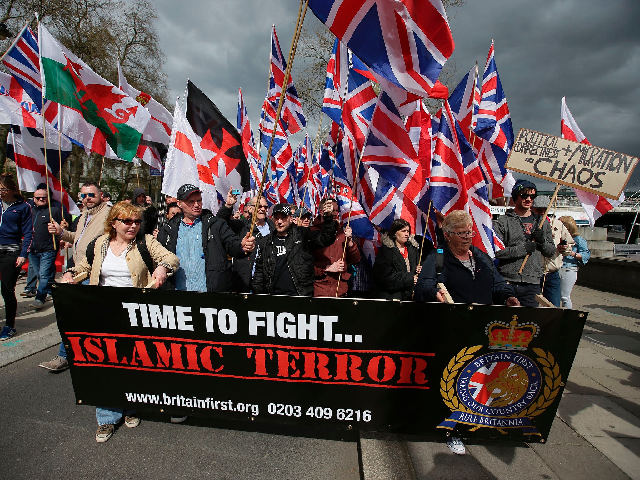 Members of the far-right group Britain First march with flags in central London on 1 April 2017, following the Westminster attack (AFP/Getty Images)