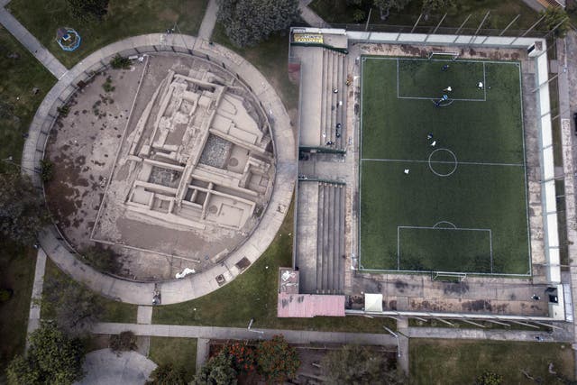 Pre-Columbian archeological site La Luz is flanked by a private soccer field players rent in Lima, Peru