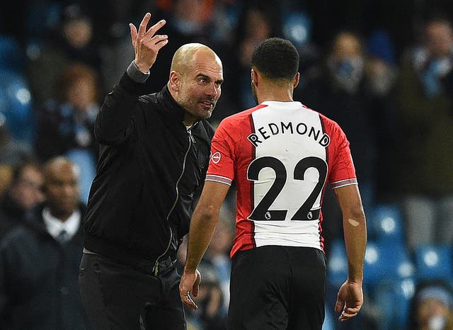 Pep Guardiola remonstrates with Nathan Redmond