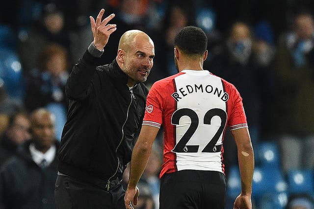 Pep Guardiola remonstrates with Nathan Redmond