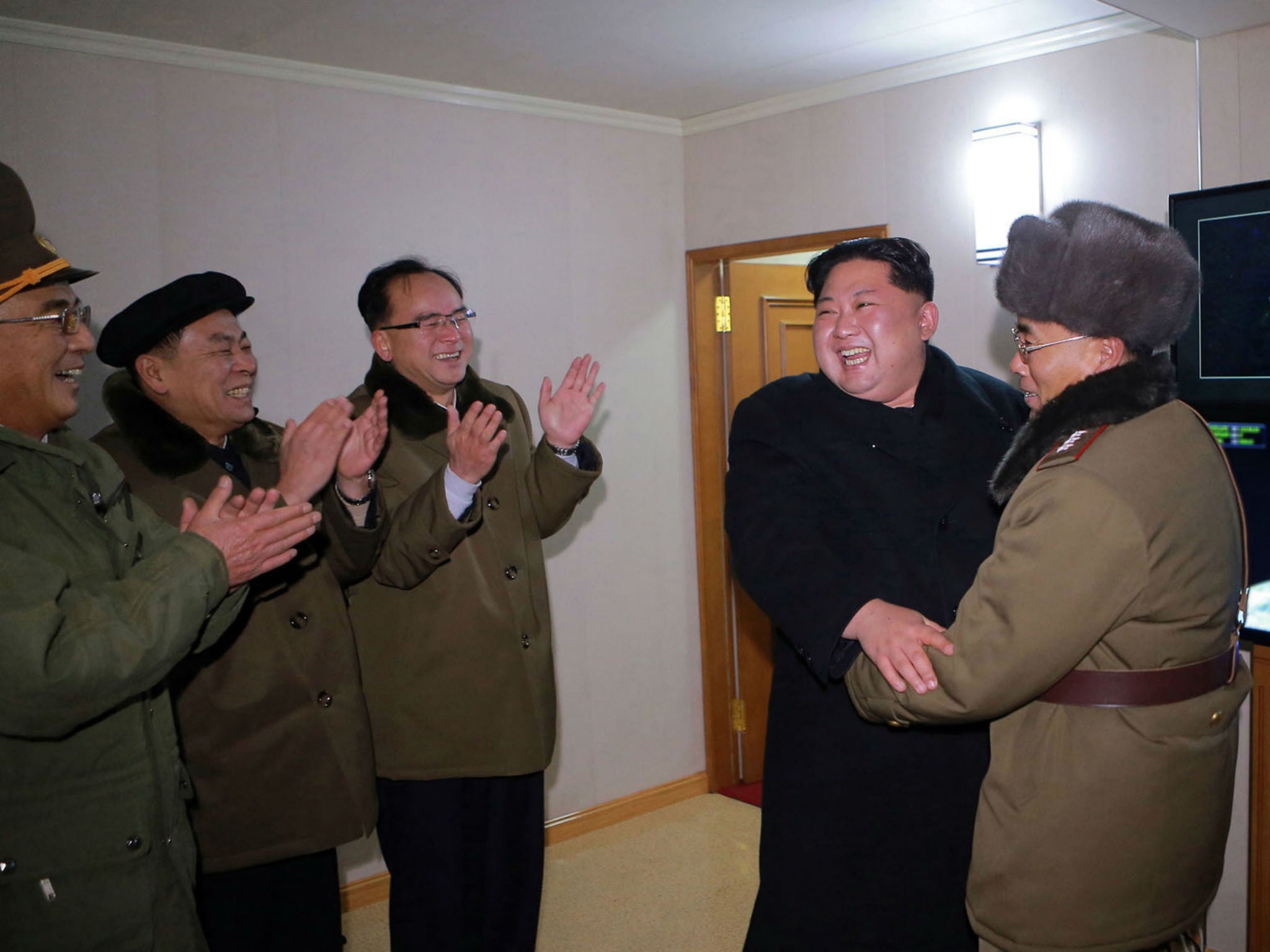 In this photo provided on Thursday, Nov. 30, 2017, by the North Korean government, North Korean leader Kim Jong Un inspects an intercontinental ballistic missile test in North Korea on Wednesday, Nov. 29