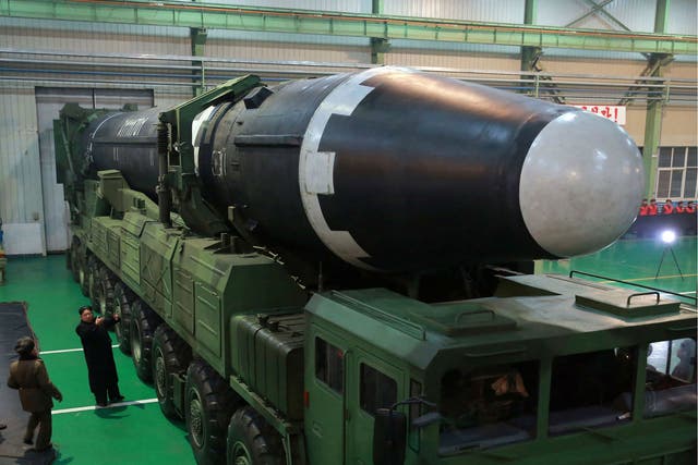 North Korean leader Kim Jong-un inspects the Hwasong-15 intercontinental ballistic missile