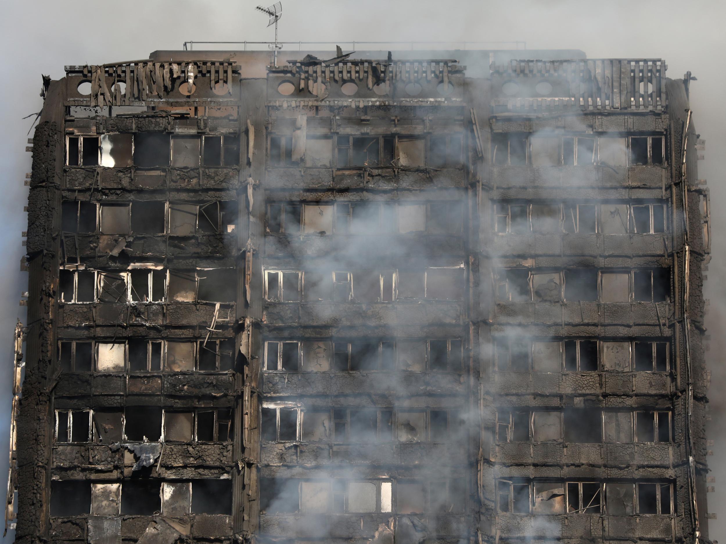 Smoke billows from a tower block severly damaged by a serious fire, in north Kensington, West London 14th June Reuters