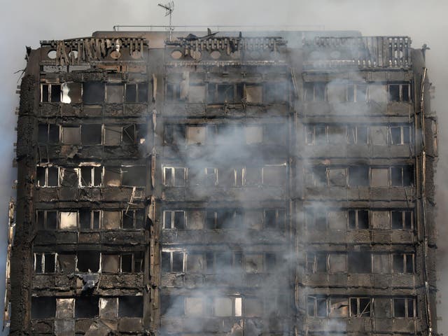  Smoke billows from the Grenfell Tower in Kensington, where 71 people were killed