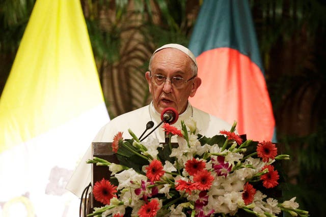 Pope Francis speaks during a meeting with officials, members of civil societies and diplomats at the presidential palace in Dhaka, Bangladesh