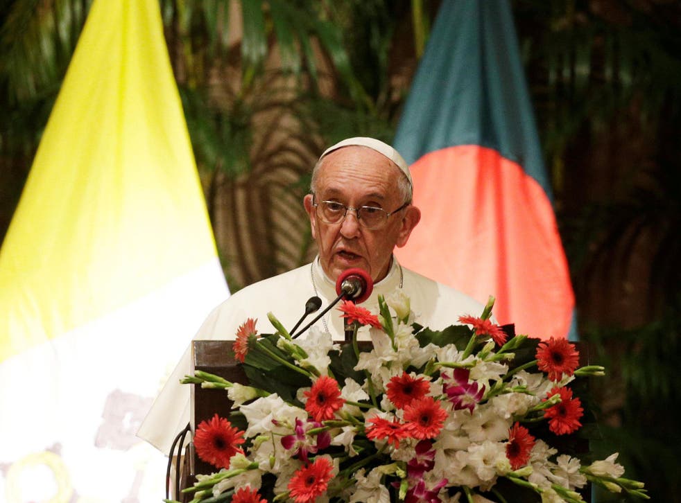 Pope Francis speaks during a meeting with officials, members of civil societies and diplomats at the presidential palace in Dhaka, Bangladesh