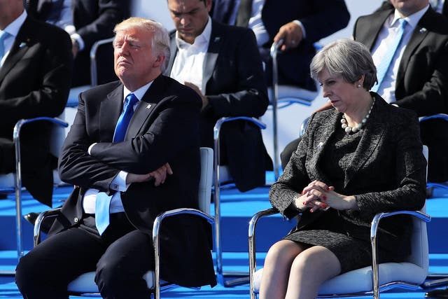 US President, Donald Trump and British Prime Minister, Theresa May are pictured ahead of a photo opportunity of leaders as they arrive for a NATO summit meeting on May 25, 2017 in Brussels, Belgium