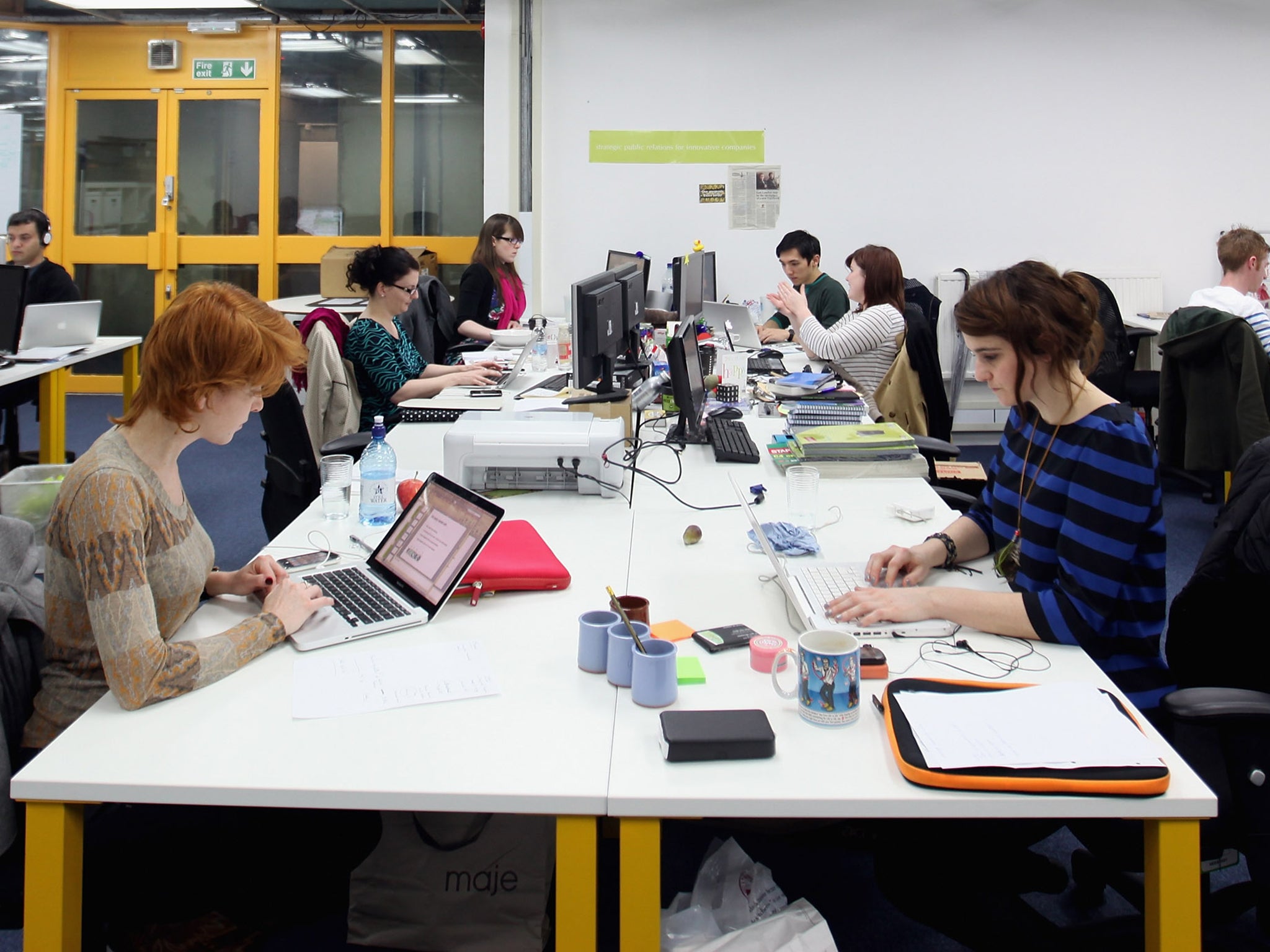 People work at computers in TechHub, an office space for technology start-up entrepreneurs, in Shoreditch