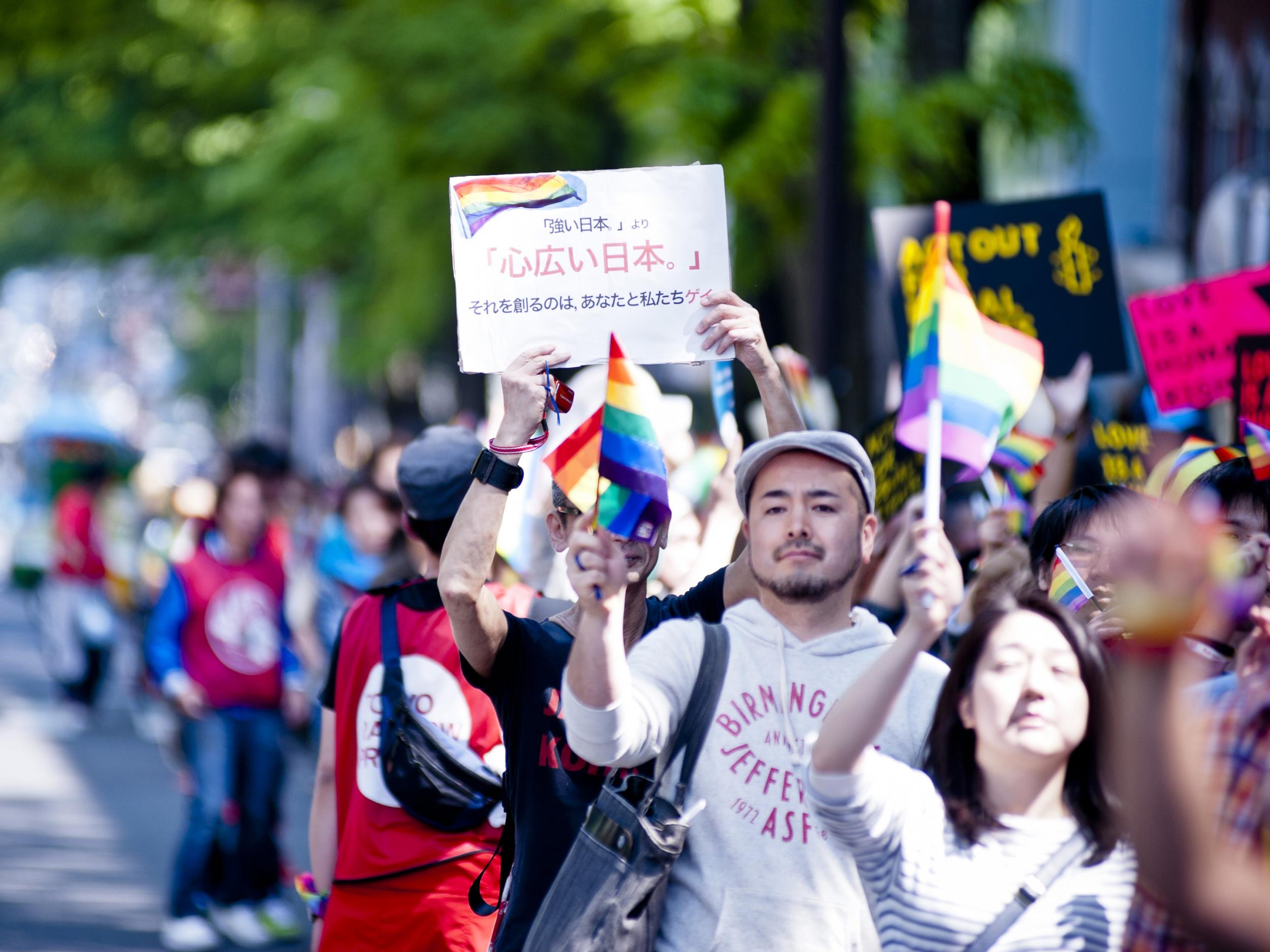 Participants in the Tokyo Rainbow Pride parade march through the streets of Shibuya district on April 28, 2013 in Tokyo, Japan.