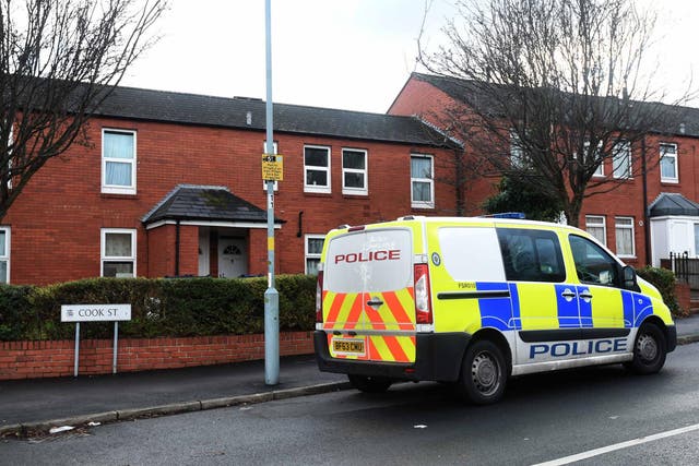 Two people have been arrested after a seven-year-old was found dead outside his home