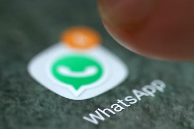 The WhatsApp app logo is seen on a smartphone in this picture illustration taken September 15, 2017