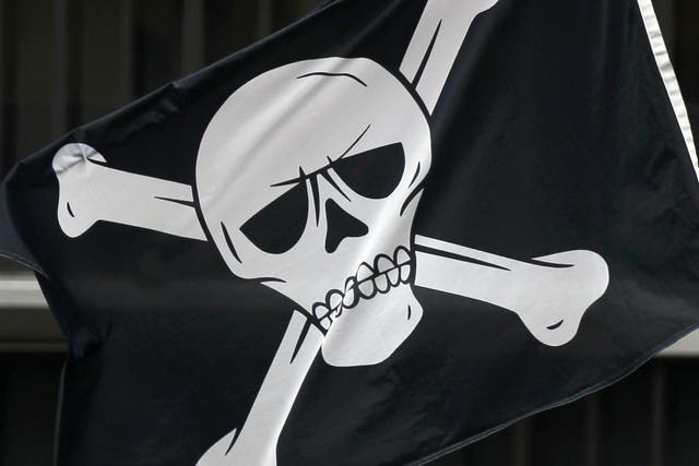 A pirate flag is seen during a protest by workers and trade union representatives from all over Europe against austerity outside Belgium's national bank (BNB) headquarters in Brussels February 29, 2012
