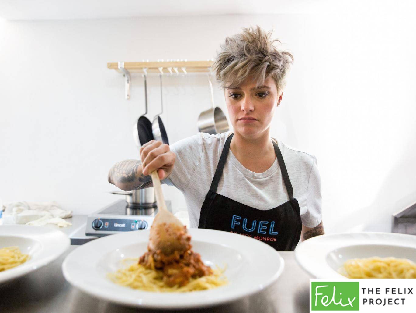 Jack Monroe cooking at launch of Fuel Bank, a charitable pop-up raising awareness of the 'heat or eat' crisis