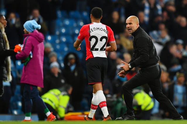 Pep Guardiola confronts Nathan Redmond after City's midweek victory over Southampton