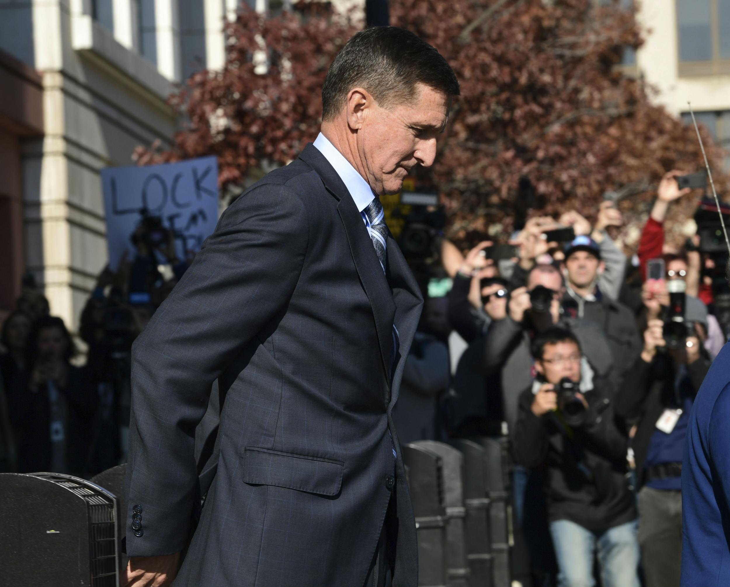 Michael Flynn leaves court after entering his guilty plea on Friday