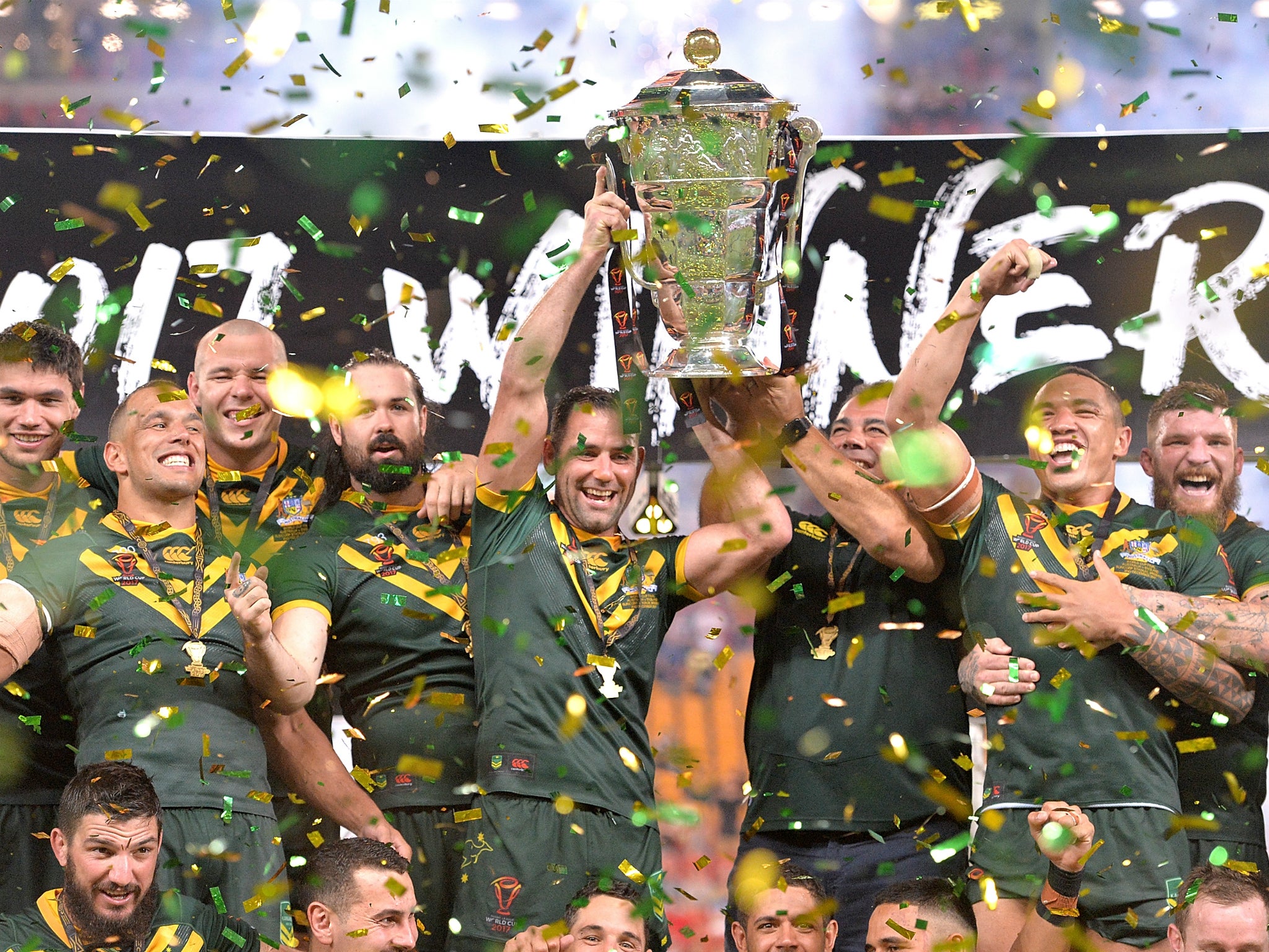 Cameron Smith and coach Mal Malinga lift the Rugby League World Cup