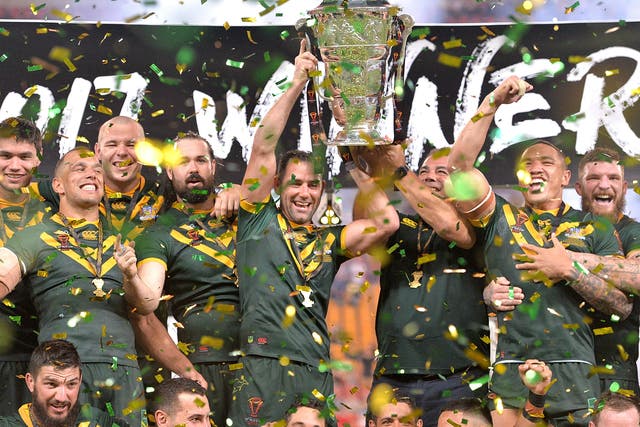 Cameron Smith and coach Mal Malinga lift the Rugby League World Cup