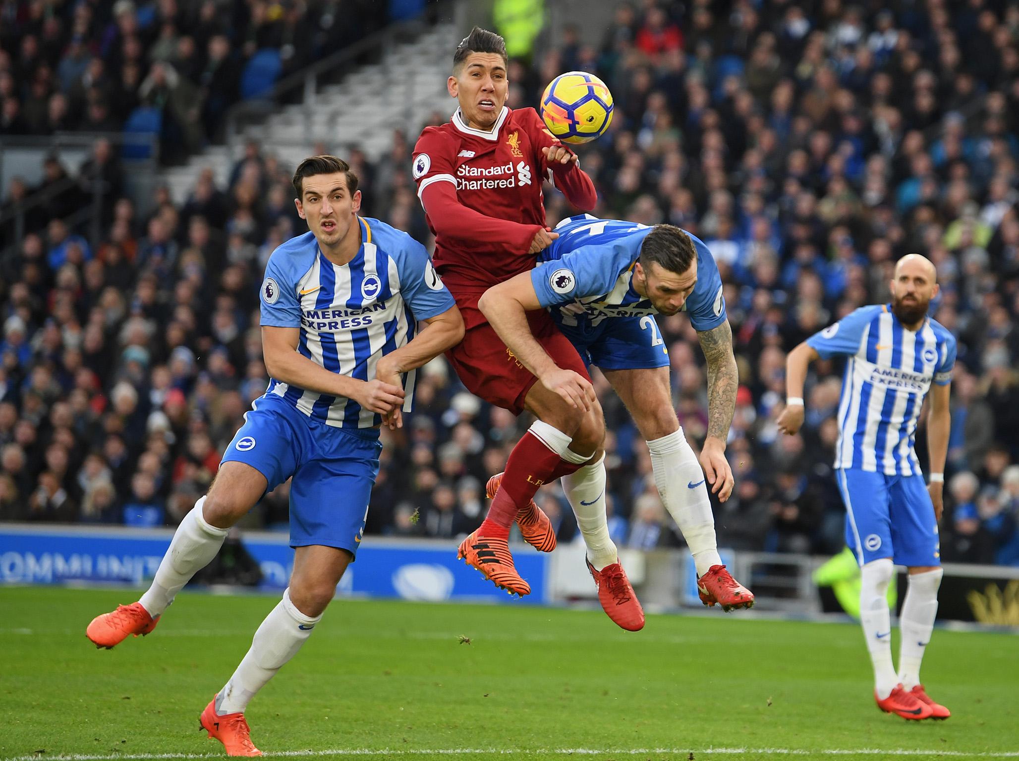 Roberto Firmino gets stuck in at the Amex
