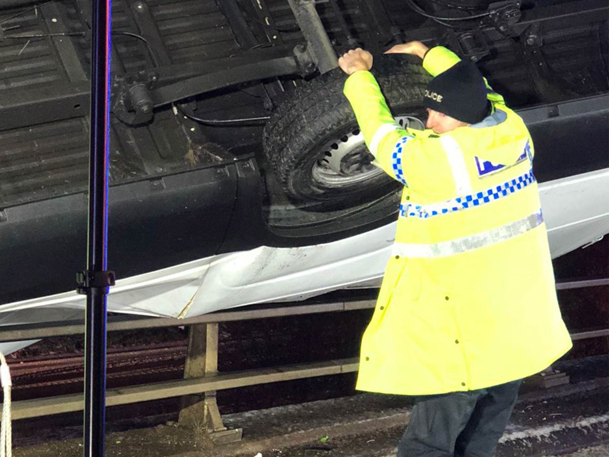 PC Martin Willis had to grab the van to prevent it falling off the edge of a motorway bridge