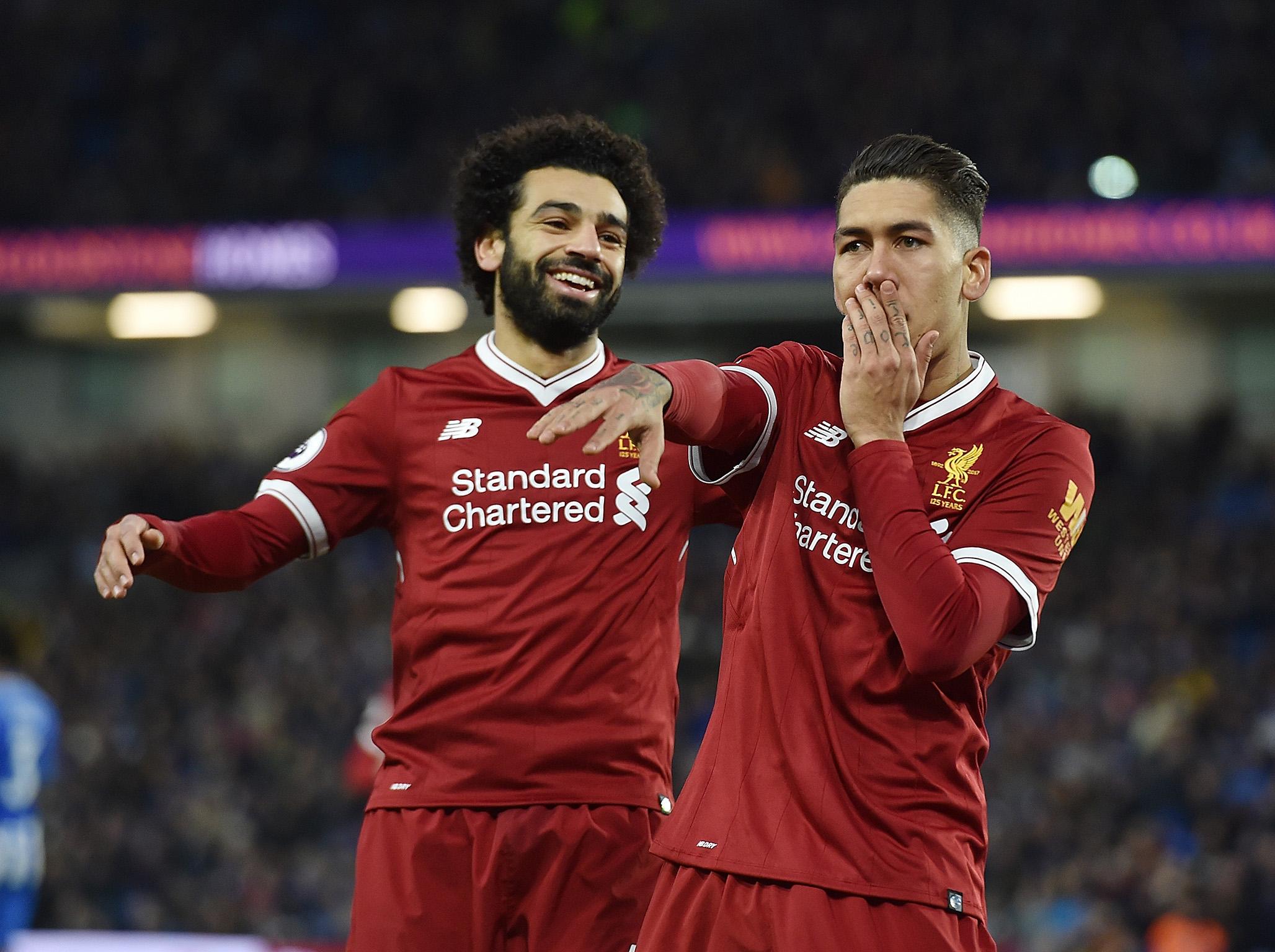 Roberto Firmino celebrates putting away Liverpool's third goal