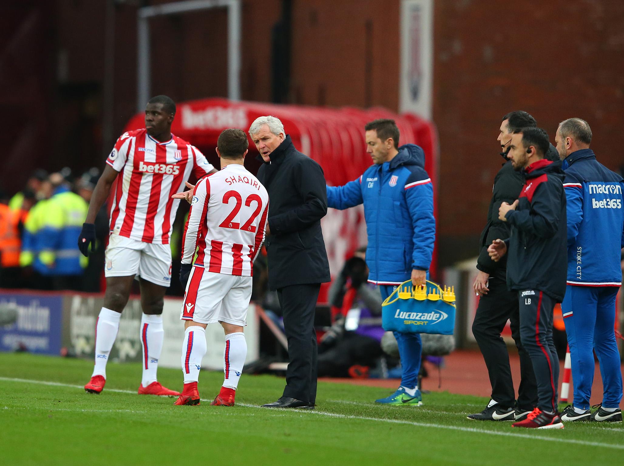 Xherdan Shaqiri receives some instructions from Mark Hughes