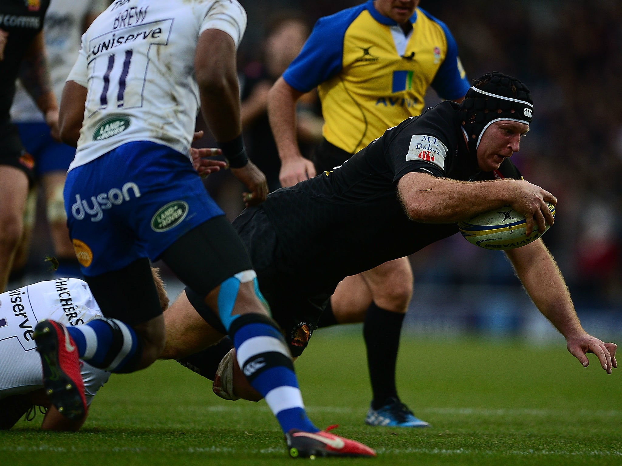 Thomas Waldrom dives over the try line to score for Exeter Chiefs