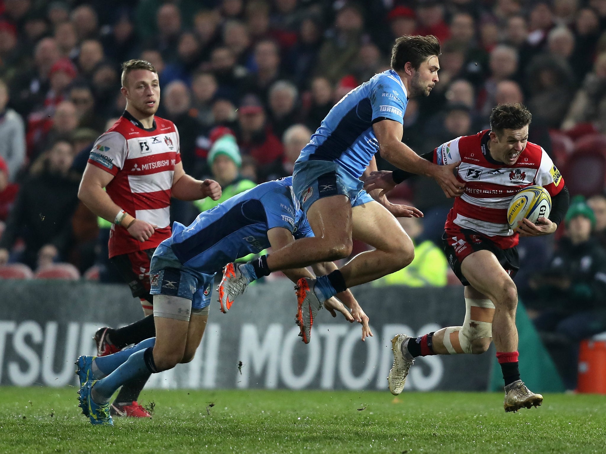 Billy Burns breaks free of the London Irish defence to score for Gloucester