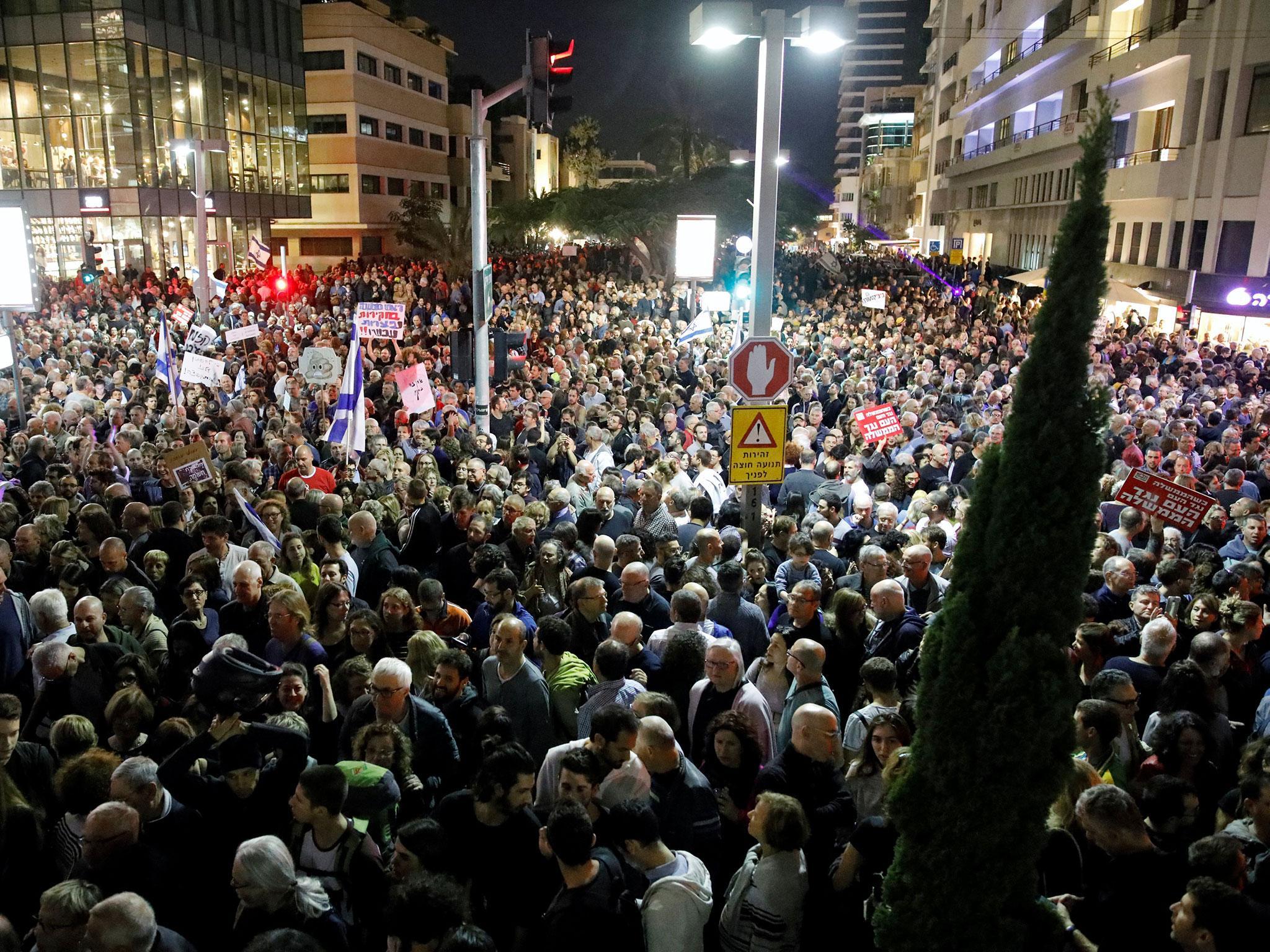 Tens of thousands of Israelis poured into the streets of Tel Aviv for an anti-corruption rally calling on Benjamin Netanyahu to resign