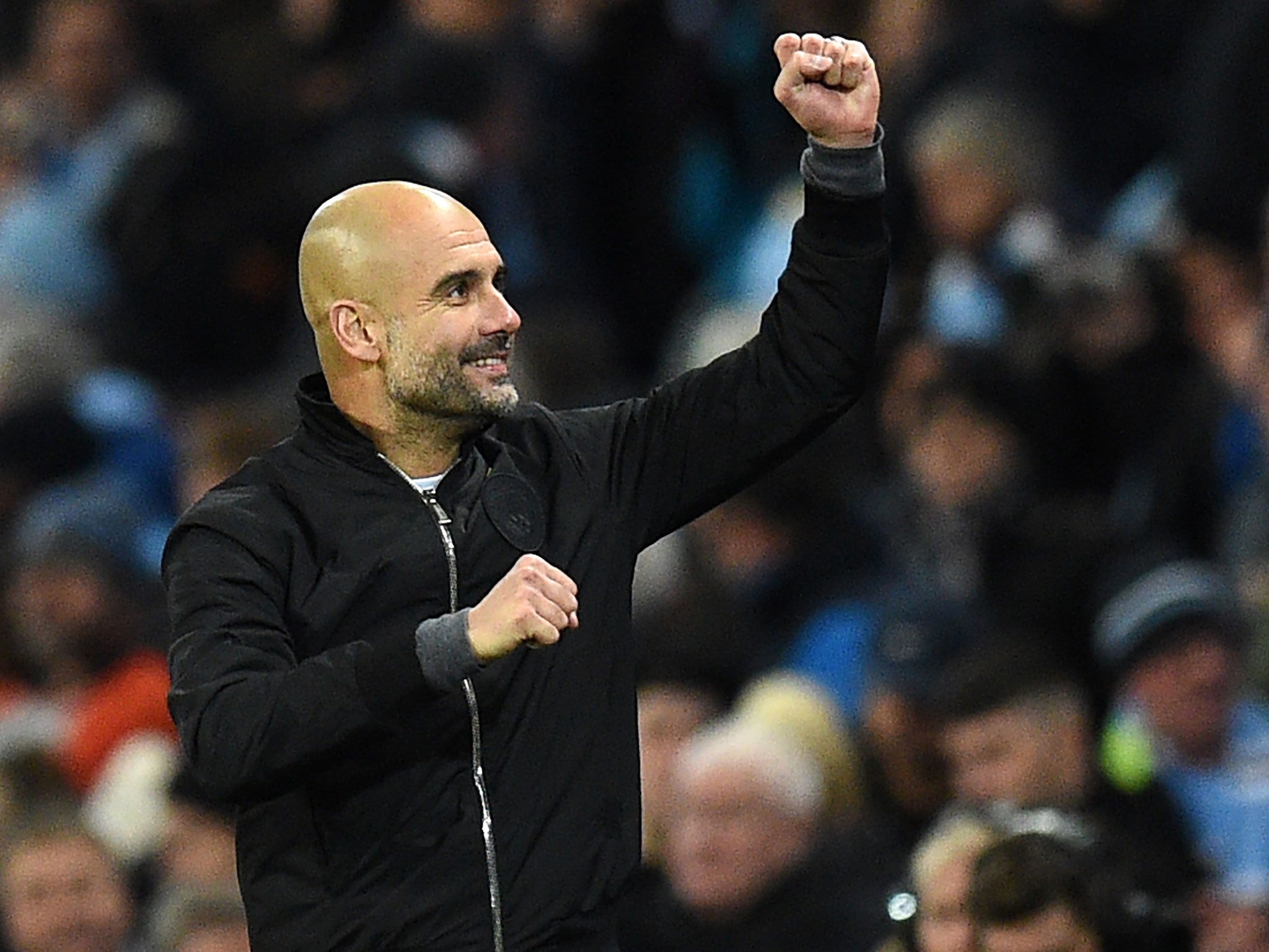 Pep Guardiola celebrates after his side's victory over West Ham