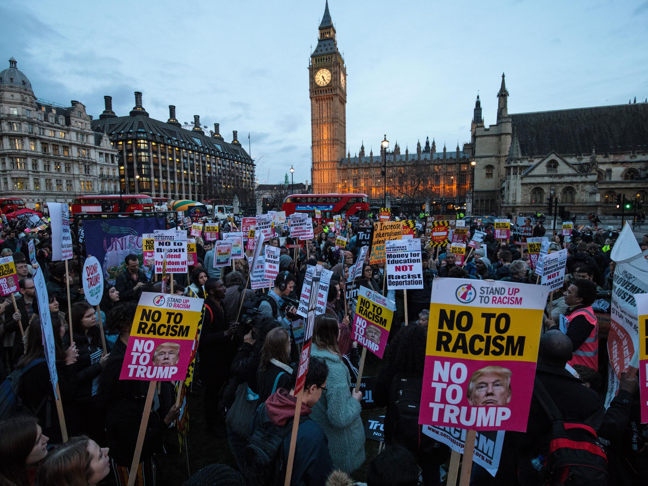 Protesters holding placards take part in a rally in Parliament Square in February 2017 against US president Donald Trump's state visit to the UK