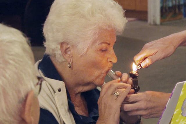 Pam St Clement using a bong on 'Gone To Pot'