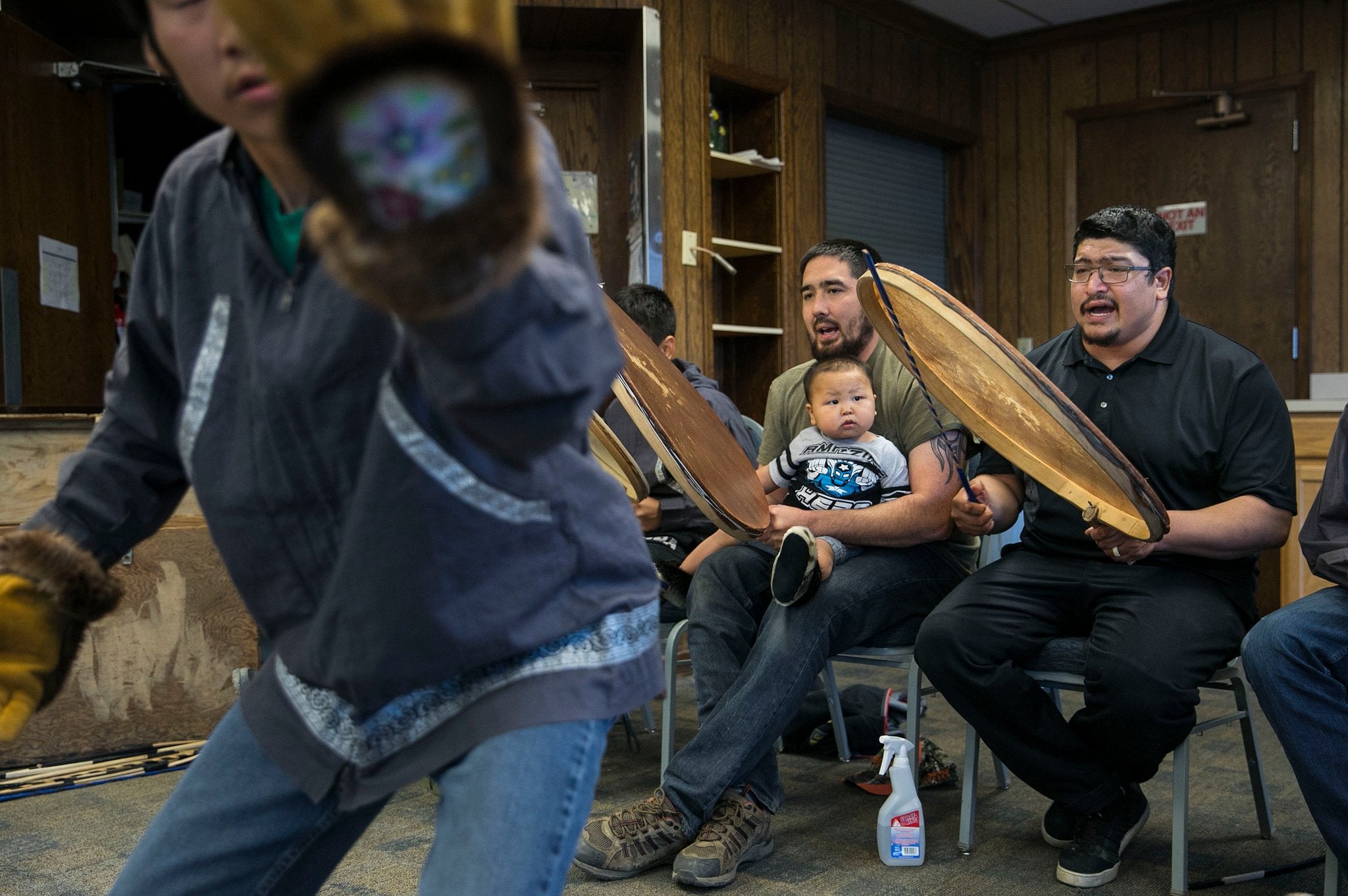Bryan Muktoyuk (right) rehearses traditional Inupiaq songs with drummers and dancers in Nome
