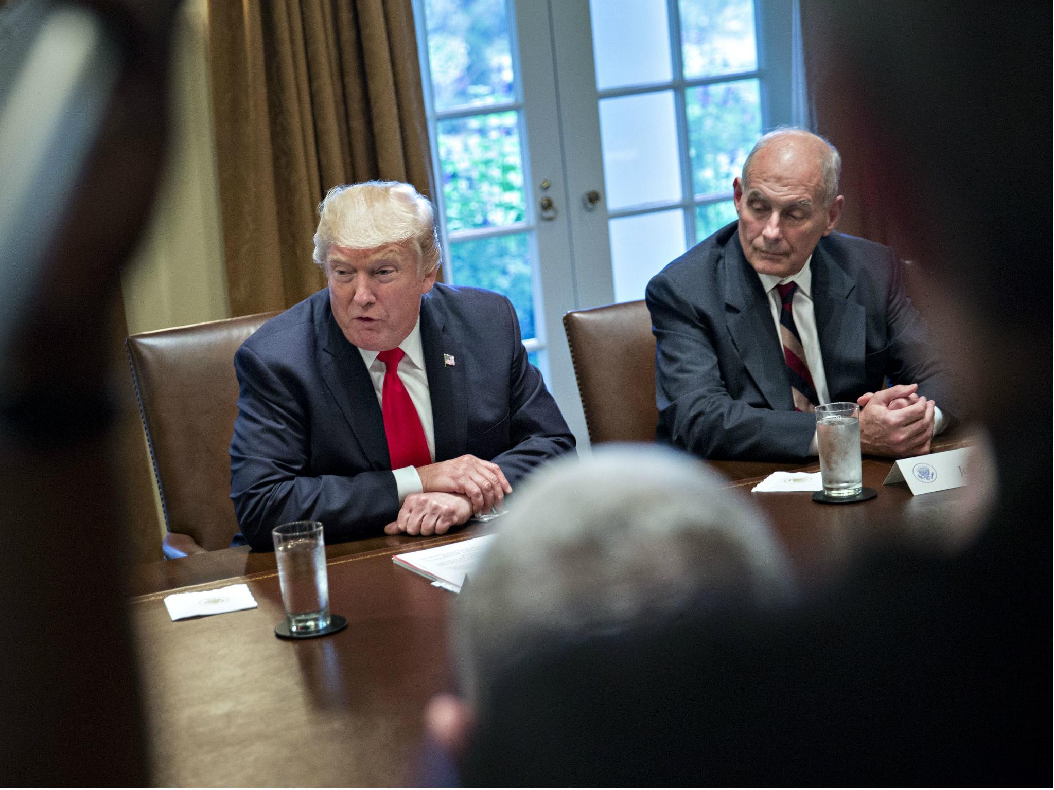 US President Donald Trump speaks as White House chief of staff John Kelly at a briefing with senior military leaders in 5 October 2017