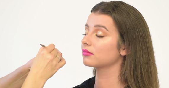 Apply gold glitter for a bit of party dazzle