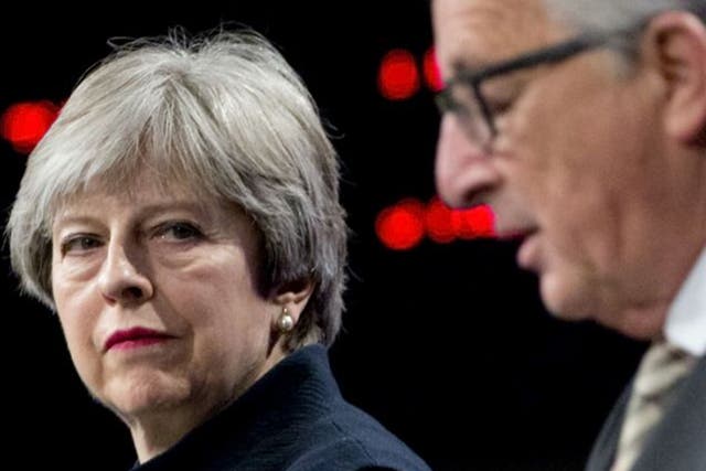 Theresa May and the European Commission President Jean-Claude Juncker last month, when the talks moved onto a hoped-for transition deal