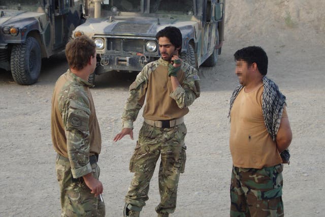 Mr Husseinkhel (centre) worked as an interpreter for a British Army squadron in Helmand led by Mr Locke (left) in Afghanistan in 2011. He has now, after nearly two years in the UK, been told he is to be removed from the country within days